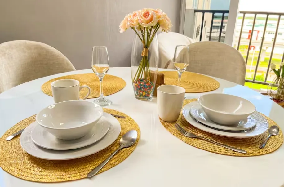Dining table set with flowers and wine glasses, Panama airbnb near Tocumen