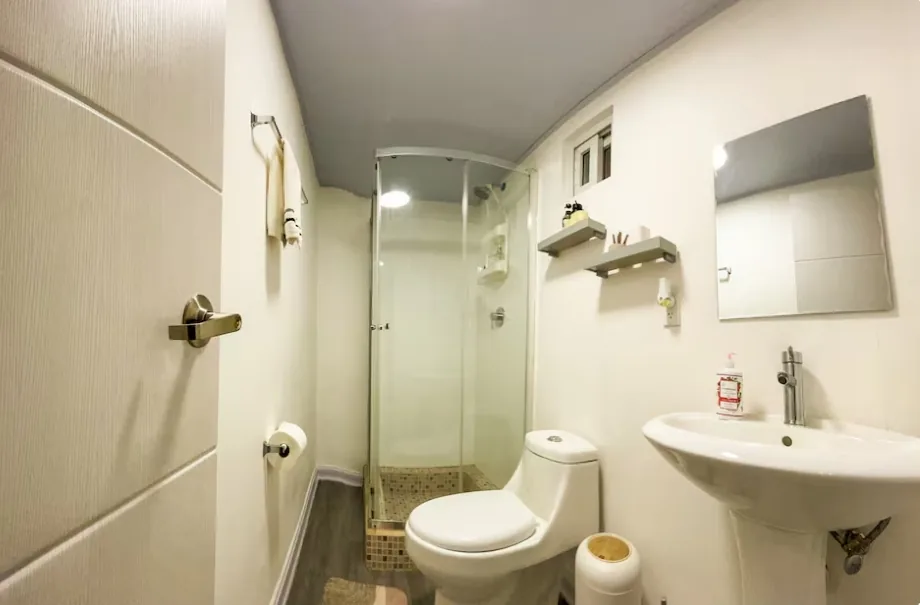 Private bathroom with glass shower and sink, apartment near Tocumen Airport